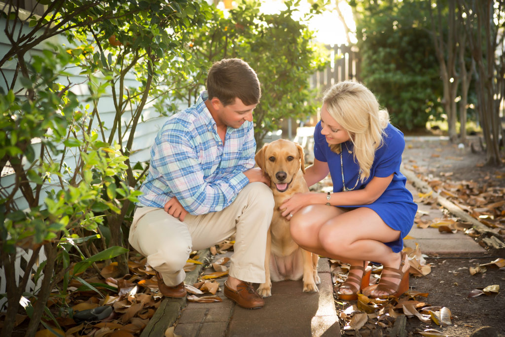 Engagement session with dog and couple in downtown Biloxi