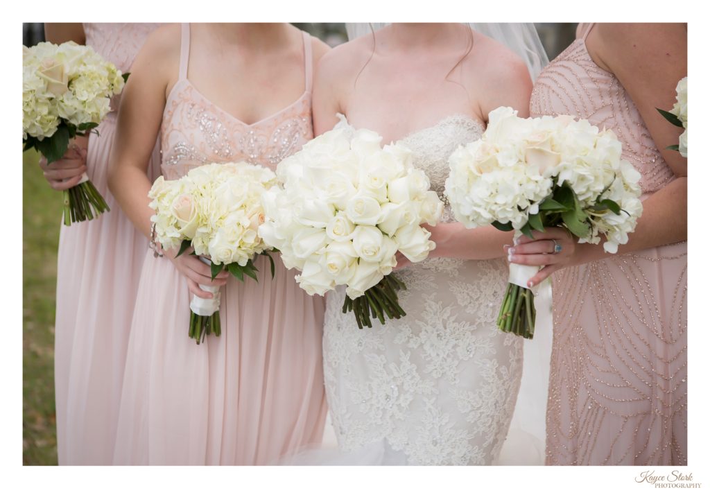Biloxi MS Wedding Photographer photo of Bride and bridesmaids holding bouquets from Pine Hills Floral Design