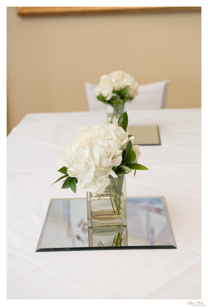 Delicate wedding centerpieces with hydrangea bouquet at the Bay Waveland Yacht Club in Bay St Louis MS
