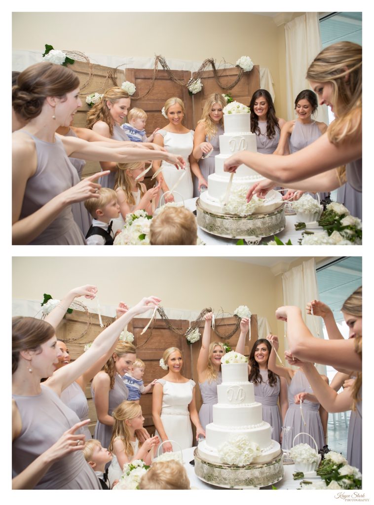 Cake Pull with Bride and bridesmaids southern tradition wedding reception at Bay Waveland Yacht Club in Bay St. Louis