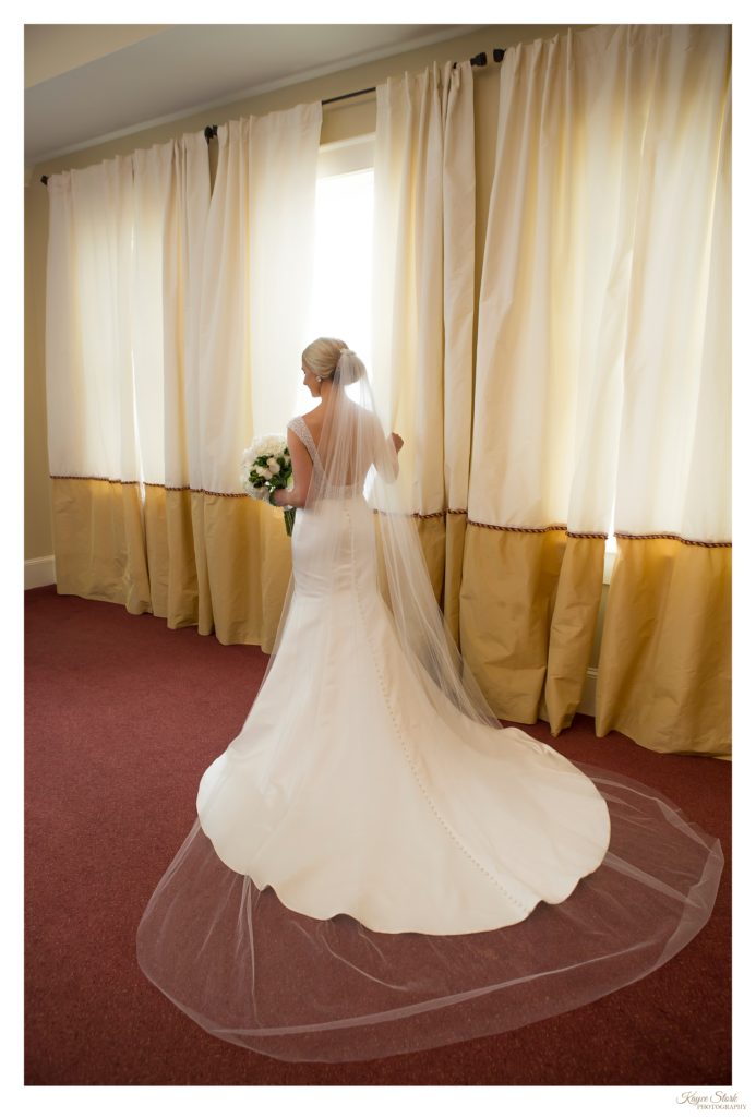 Bride in Custom gown from MaeMe's Bridal Boutique at the Bay Waveland Yacht Club